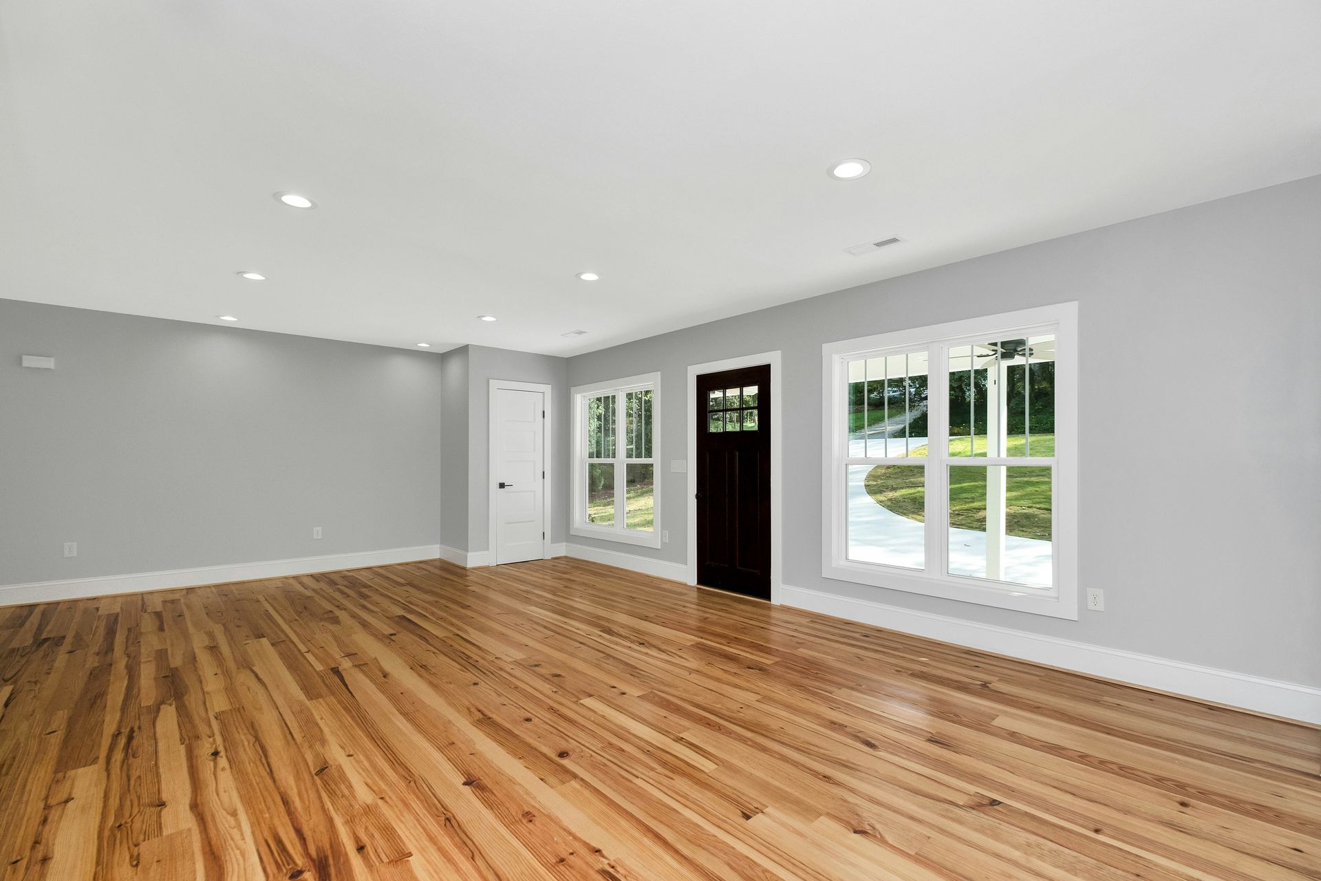 a room with a wood floor and a wood floor